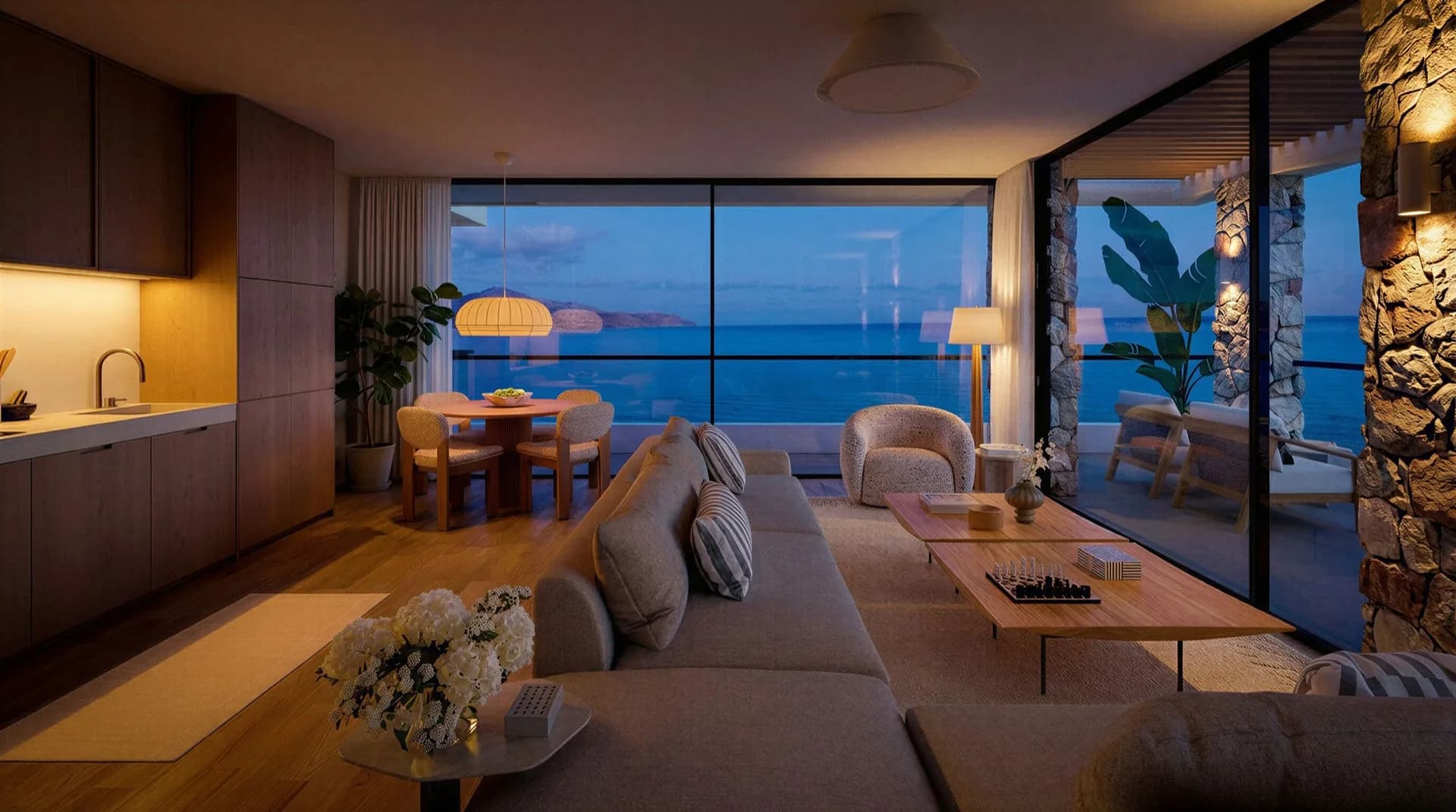 196 Kalyves, Living room at dusk, glazed onto the Aegean